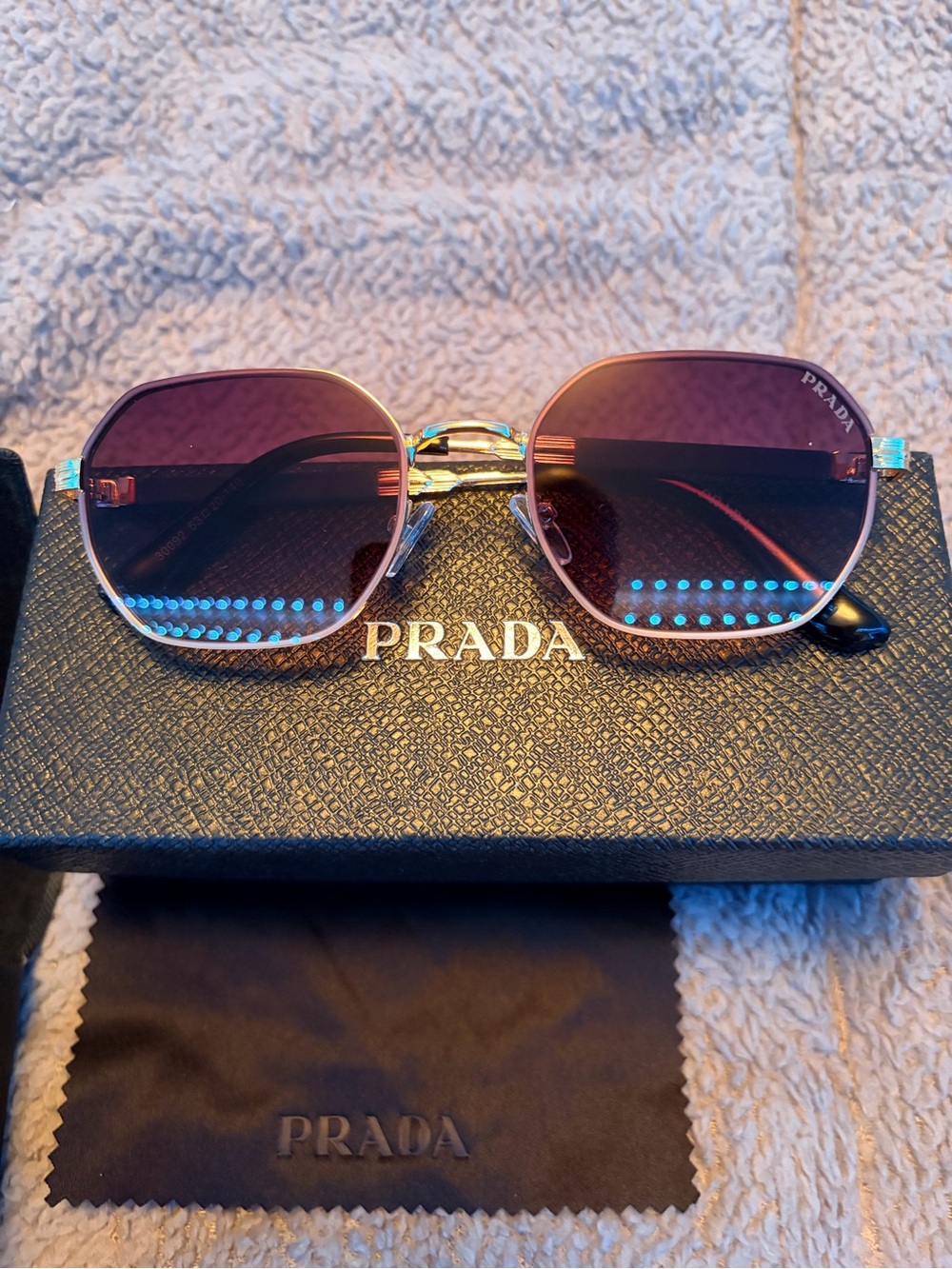 Prada Gold Frame Sunglasses with Purple Lenses